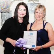 WELL DONE Dawn, right, receives her award from Kirstie Baxter at the ceremony