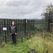 Green Cllr Malcolm Peplow at a metal fence on Martholme Viaduct