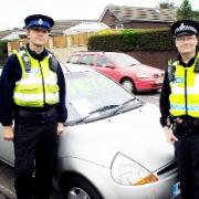 ALERT PCSO Ian Pickles and PC Mick Jones are among police keeping an eye on rogue traders who sell cars at the roadside