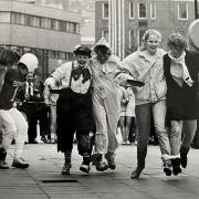 Fancy-dress pancake racers in Blackburn town centre, 1987