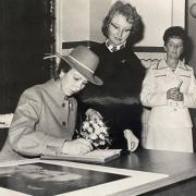 Princess Anne signs the visitors' book and a commemorative photograph at Blackburn Infirmary in October 1980