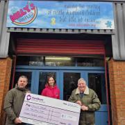 Cllr Steven Smithson, Lorraine Hargreaves and Cllr Peter Britcliffe with the cheque
