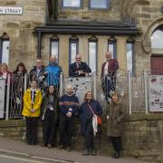 Councillors and Historic England representatives outside The Alliance in Bacup, which was transformed