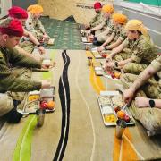 Members of the armed forces visit a Gurudwara