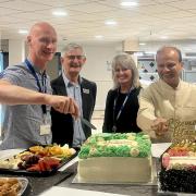 Head of hospital charities Dan Hill, Rosemere Cancer Foundation’s chairman John Hodgson and fundraising manager Sue Swire join Professor Mohammed Munavvar in serving food at the iftar