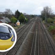 A railway worker was almost hit by a train travelling at 110mph in Lancashire
