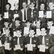 District Commissioner Jeff Harrison with Scouts who received their Scouts, Pathfinder and Explorer Awards at Blackburn and District Scouts annual awards evening in 1990