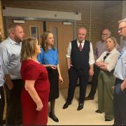 Health minister Helen Whately (in the blue shirt in the centre) discusses the challenges facing the Royal Blackburn Hospital with the MPs and senior staff
