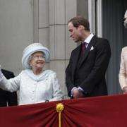 The Prince of Wales, the Queen and the Duke and Duchess of Cambridge on the palace balcony.