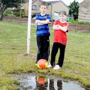 Logan and Leah Davey at the waterlogged pitch