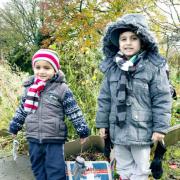 DOWN TO EARTH Sami and Hasan Iqbal busy on Bent Head Children’s Allotment, in Nelson
