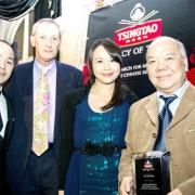 Tsingtao Legacy of Taste judges, Antony Edwards and TV chef Ching-He Huang, with Charlie Yu (right) and son Victor (left)