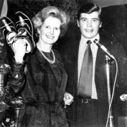 Mrs Thatcher receives a pair of clogs made by Mr J Crawshaw, of Miller Barn Lane, Waterfoot, from David Trippier, Conservative prospective candidate for Rossendale in 1977