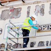 Work is being carried out to restore the pub sign