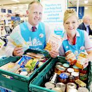 Tesco staff Richard Cross and Tracey Gleave collect for Fair Share in Burnley