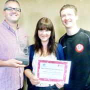 Proud of their award, from left, Mark Hirst, Deborah Clark and Dave Scholes from Community Solutions