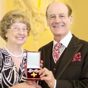 Mavis Dagger receives her award from Lord Lingfield