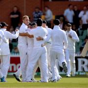 England's Stuart Broad (centre) celebrates taking the wicket of Australia's George Bailey (right) during day one of the Second Test Match at the Adelaide Oval