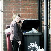 Mavis Reece with the overflowing bins