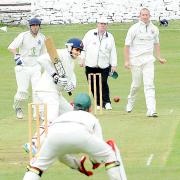 Read's Elliott Lowes bowls at Whalley's Wilkin Mota during Saturday's top of the table clash Picture: HELEN BROWN