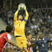Hugo Lloris claims a high ball for France against Paraguay