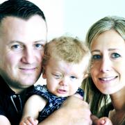 Parents Natasha Scott and Philip Davies with daughter Elyssa