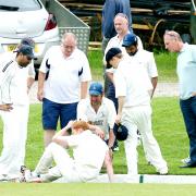 Todmorden’s Kristian Garland is attended to after colliding with the boundary