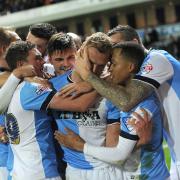 Blackburn Rovers players celebrate with goalscorer Jordan Rhodes during Saturday’s victory at home to Leeds