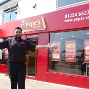 HUB: Asad Khalil outside Pepe’s Piri Piri Restaurant which is one of the most recent shop fronts to be completely renovated.
