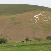 IMPRESSIVE: How the cyclist etched on the Pendle Hill landscape will appear before the Tour of Britain race