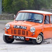 HOT STUFF: Steve Entwistle had to put flames out on his Orangebox Mini during the Northumberland Borders Rally