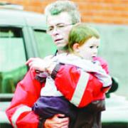 IN DAD'S ARMS: Three-year-old Lee Loram  is hugged by his father Neville after they were reunited in Blackburn