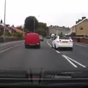 IDIOTIC: The driver attempts to overtake on a bend