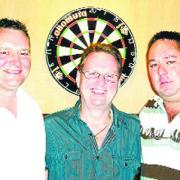 ON TARGET: Latest Bull and Royal qualifiers Tony Stone (left) and Jason Dewhurst (right) with pub andlord Andy Hunt