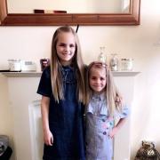Tienna Cooper, nine, and her sister Ziani, six