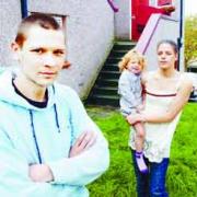 FORCED OUT: Martin Messa and partner Victoria Boyd with daughter Megan, outside the house