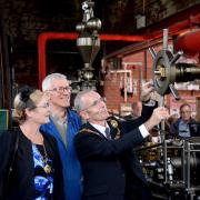 Bancroft Mill, Barnoldswick  centre Treasurer Tony Nixon lets  Mayor of Pendle Cllr David Whalley and Mayoress Barbara Whalley start one of the steam engines.