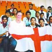 EASTERN DELIGHT: Burnley’s Sophie Hitchon is pictured with young Indian spectators at the Commonwealth Youth Games