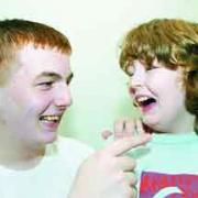 FUNNY BUSINESS: Lewis Costello has his brother Isaac in stitches