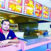 ORDEAL:  Sajjd Shabbir at the takeaway where the armed robbers fired the gun at him during the incident yesterday