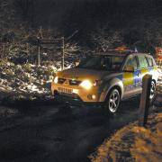 CRIME SCENE: A police car at the entrance to the car park near Anglezarke Reservoir where the man’s body was found