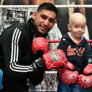 Oliver Welch aged three who is suffering from a rare form of cancer, met Amir Khan at his gym in Bolton.