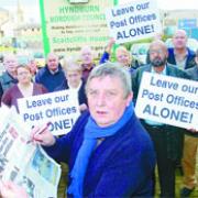 MAKING A STAND: Hyndburn Council leader Peter Britcliffe with campaigners against the post office closures
