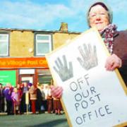 MAKING A STAND: Protesters including Irene Lindsay (front) gather outside the under-threat Hapton Post Office
