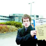 REBUFFED: Lancashire Telegraph reporter Ben Briggs at Post Office headquarters with the petition opposing closures