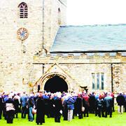 TEARS AND LOVE: The funeral service is relayed to hundreds of mourners outside St Mary's Church, in Gisburn