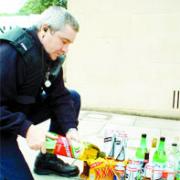 DRAIN: PCSO Gerry Woods pours away seized alcohol
