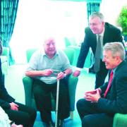 CARE: Minister Alan Johnson (right) with Chorley MP Lindsay Hoyle and Buckshaw residents