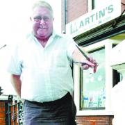 CUTTING IT: Barber Martin Baybutt suffered an injury to hs leg which he initially failed to recognise, due to him having diabetes which means he has almost no feeling in his feet.