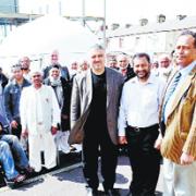 READY: Mosque members and Burnley Council officials, and, front, from the left, architect Dr Najib Gedal, Coun M A Malik and Coun Mozaquir Ali, gather